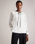 KELEIH-Tops-Channel vintage glamour with a modern twist in the KELEIH blouse. Its delicate organza ruffles and darts exude timeless elegance, while the crew neck keeps it versatile. Whether you're attending a formal event or dressing up for a date night, this blouse will effortlessly elevate your look. Blouse Organza ruffles on front Long sleeves Contrast stitching and neck tie Button fastening Darts on shoulders Crew neck with contrast binding Silvia is 5'11" / 1.8m and wears White in a Ted size 1- Ted Bak